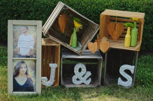 Engagement photos in old window frame, stacked crates, DIY wedding decor